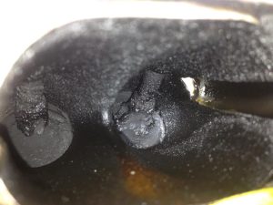 build up carbon on the backs of an engine intake valves